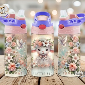 May include: Three water bottles with a floral and lamb design. The bottles have a pink and purple lid and base. The main design features a lamb wearing a floral crown and a cross necklace, surrounded by roses and a dove. The text "G's LITTLE BLESSING" is visible.