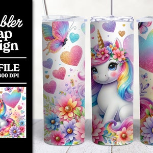 May include: A white tumbler wrap design featuring a unicorn with a rainbow mane and tail, surrounded by flowers, butterflies, and glitter hearts. The design is on a white background.