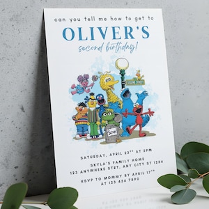 May include: A white invitation card with the text "can you tell me how to get to OLIVER'S second birthday!" and a colorful illustration of Sesame Street characters. The card includes event details: date, time, location, and RSVP information.