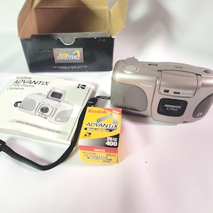 Kodak C700 Advantix autofocus film compact camera zoom point shoot box instructions black and white photograph photographer picture artist