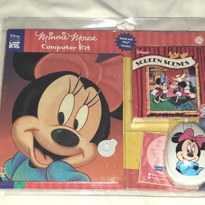 May include: A Minnie Mouse computer kit featuring a colorful image of Minnie Mouse on the front. The kit includes a CD-ROM labeled "Disney's Screen Scenes: Mickey and Crew".