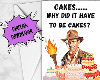 May include: A white card with a humorous birthday card design featuring a cartoon image of Indiana Jones holding a torch and surrounded by birthday cakes. The text on the card reads "Cakes..... Why did it have to be cakes?"