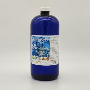 May include: A blue bottle of colloidal silver supplement labeled "Pure Health" with a silver atom symbol and the text "120ppm" on the label. The bottle is 32 ounces and contains 99.99% pure silver.