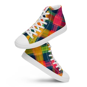 May include: High-top canvas sneakers with a vibrant plaid pattern in shades of yellow, orange, pink, and blue. The shoes have white laces, a white rubber sole, and a white toe cap. The sneakers are designed for casual wear.
