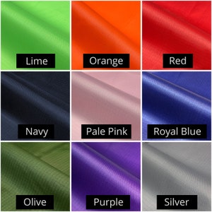 May include: Nine fabric swatches in various colors, including lime, orange, red, navy, pale pink, royal blue, olive, purple, and silver. Each swatch has a label with its color name in a black rectangle.