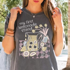 My first lemonade stand t shirt for women, Comfort Colors funny lemon fruit table in pastel shades, hand drawn art nostalgic gift for her.