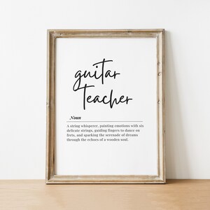 May include: A framed print with the text "guitar teacher" defined as "A string whisperer, painting emotions with six delicate strings, guiding fingers to dance on frets, and sparking the serenade of dreams through the echoes of a wooden soul."