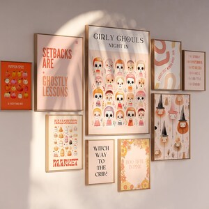 May include: A wall gallery featuring nine framed prints with Halloween-themed illustrations and text. The prints feature a variety of designs, including pumpkins, ghosts, witches, and skeletons. The text on the prints includes phrases like "Setbacks are ghostly lessons", "Girly Ghouls Night In", and "Witch Way to the Crib?"