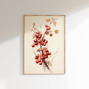 May include: A watercolor painting of a branch with red berries and green leaves. The painting is framed in a light wood frame.