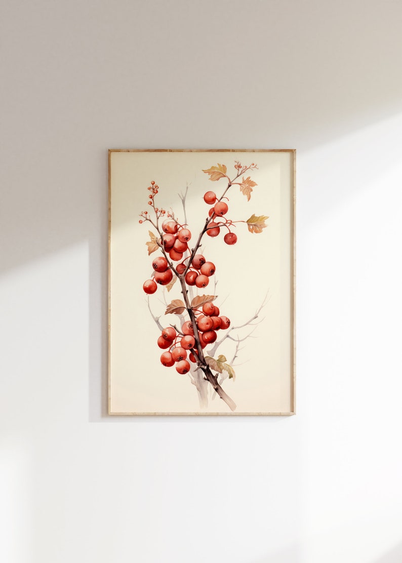May include: A watercolor painting of a branch with red berries and green leaves. The painting is framed in a light wood frame.