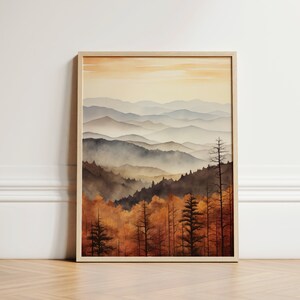 May include: A watercolor painting of a mountain range with a misty, hazy atmosphere. The mountains are layered in shades of blue and gray, with a foreground of trees in shades of brown and orange.