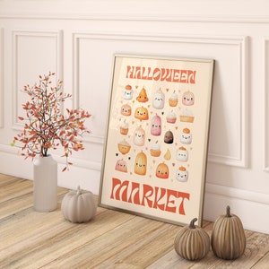 Puede incluir: Una impresi&oacute;n enmarcada con una ilustraci&oacute;n de acuarela de varios dulces de Halloween, incluyendo calabazas, cupcakes y malvaviscos. El texto "HALLOWEEN MARKET" est&aacute; escrito en una fuente retro.