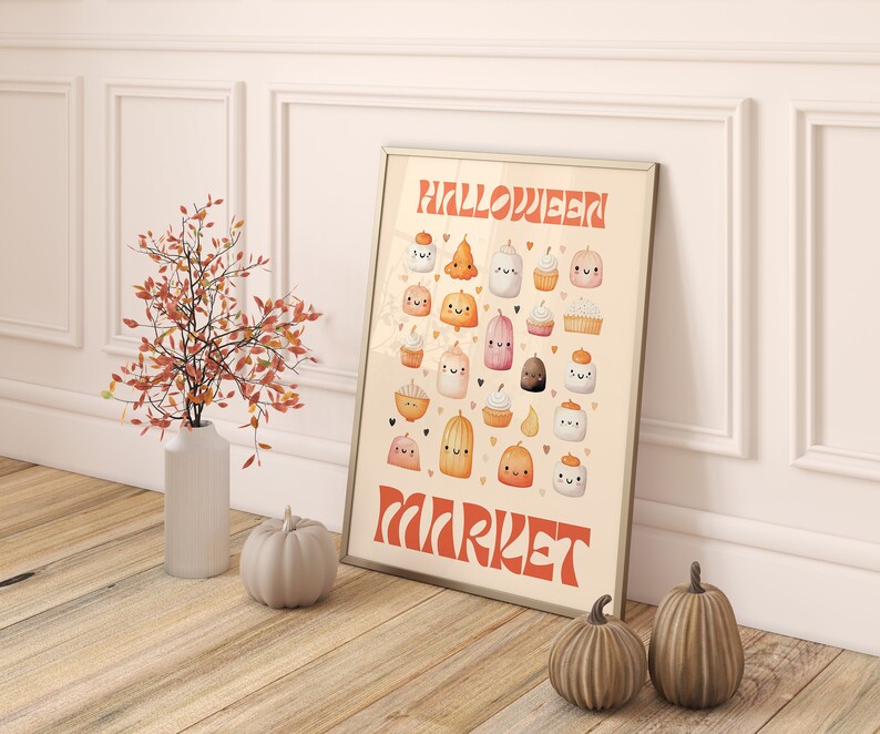 Puede incluir: Una impresi&oacute;n enmarcada con una ilustraci&oacute;n de acuarela de varios dulces de Halloween, incluyendo calabazas, cupcakes y malvaviscos. El texto "HALLOWEEN MARKET" est&aacute; escrito en una fuente retro.