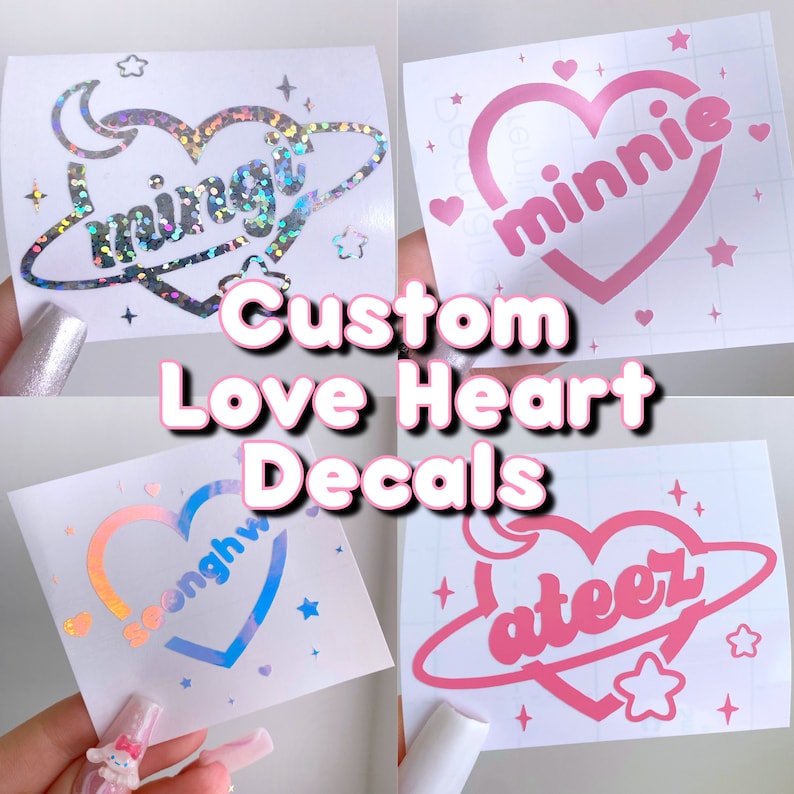May include: Four custom love heart decals with different names and designs. The decals are pink, blue, and holographic. The decals are on a white background.