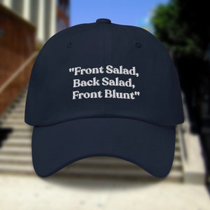 May include: A navy blue baseball cap with white embroidered text that reads "Front Salad, Back Salad, Front Blunt".