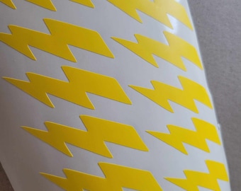 May include: A white background with a repeating pattern of yellow lightning bolts.