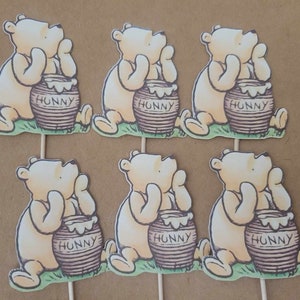 12 classic Winnie the Pooh cupcake toppers