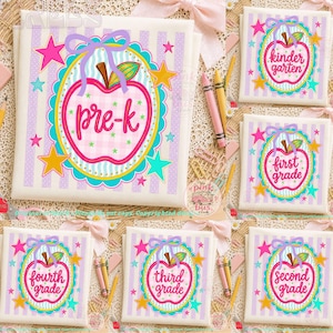 May include: A collection of six white fabric squares featuring a repeating pattern of light purple vertical stripes. Each square displays a central apple-shaped graphic with a pink outline, containing the text pre-k, kindergarten, first grade, second grade, third grade, or fourth grade, surrounded by colorful stars and a bow.