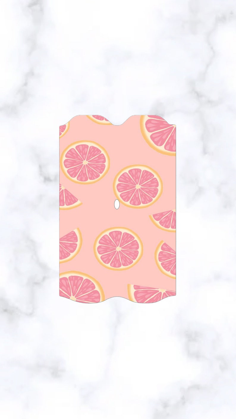 May include: Pink and yellow grapefruit slices on a pink background. The background has a wavy edge.