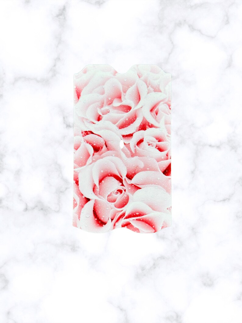 May include: A close-up of a pink and white rose bouquet with water droplets on the petals.