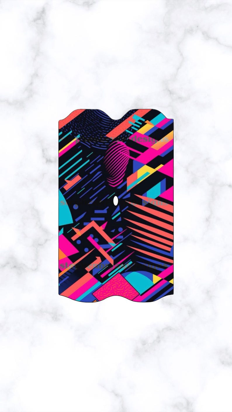 May include: A rectangular object with a vibrant geometric design. The pattern features a mix of bright colors including pink, blue, yellow, and orange, set against a black background. The design includes lines, shapes, and a textured oval.