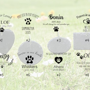 May include: Eight slate pet memorial signs with paw prints and hearts. The signs are numbered 1 through 8 and feature names, dates, and messages like "Forever Loved", "Forever in Our Hearts", "In Loving Memory Of", and "You Left Paw Prints on Our Hearts".