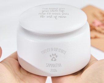 May include: A white ceramic pet memorial urn with a lid. The urn is inscribed with the words "I've loved you your whole life now I'll miss you the rest of mine." It also includes the text "Forever in our hearts," a paw print, the name "Samantha," and the year "2026."