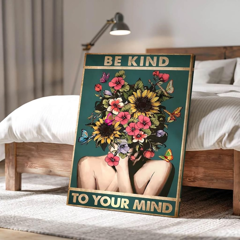 May include: A framed art print with the words "BE KIND TO YOUR MIND" on a teal background. The artwork features a woman with a floral headpiece, sunflowers, and butterflies. The frame has a gold border.