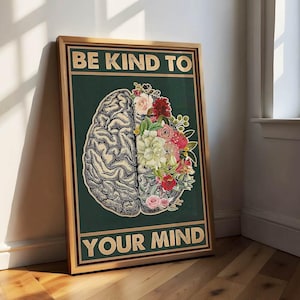 May include: A framed poster with the words "BE KIND TO YOUR MIND." The image shows a detailed brain illustration, one half filled with pink, red, and white flowers. The background is a dark green colour.
