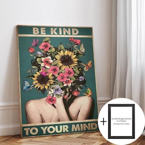 May include: A teal poster with gold text reading "BE KIND TO YOUR MIND". The artwork depicts a person with a floral headpiece of sunflowers and pink flowers, with butterflies. A black floating frame is included.