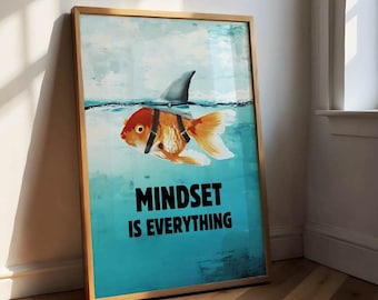 May include: Framed art print showing a goldfish with a shark fin, swimming in blue water. The text "MINDSET IS EVERYTHING" is displayed in bold, black letters. The artwork is in a wooden frame.