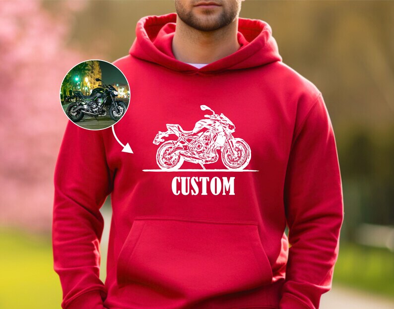 May include: Red hooded sweatshirt with a white outline of a motorcycle and the word "CUSTOM" printed on the front.