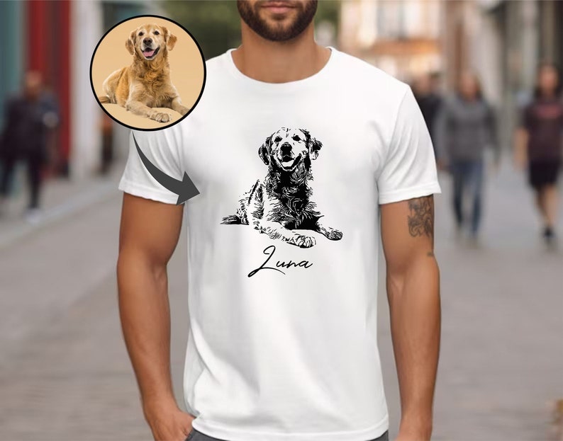 May include: White t-shirt featuring a black and white illustration of a golden retriever dog lying down. The dog's name, "Luna", is written in cursive below the illustration.