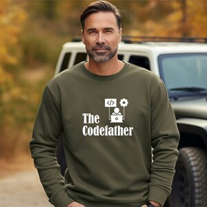 May include: A green sweatshirt with a white graphic design that says "The Codefather" with a computer, code, and gear icon.