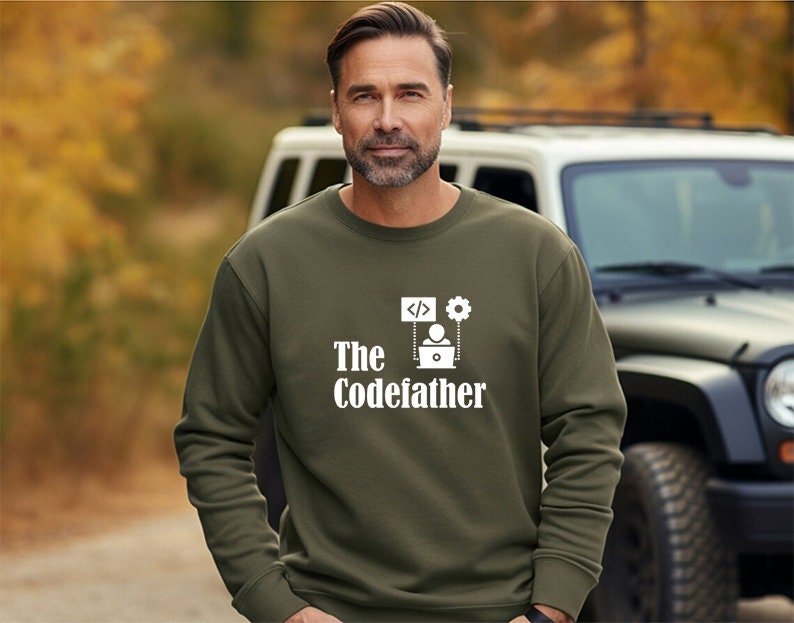 May include: A green sweatshirt with a white graphic design that says "The Codefather" with a computer, code, and gear icon.