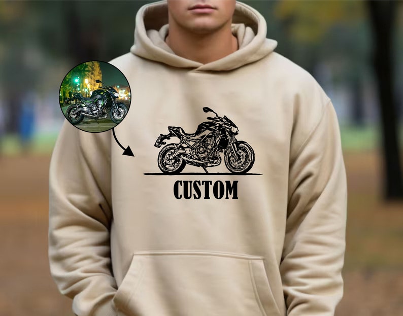May include: A beige hoodie with a black motorcycle graphic and the word "CUSTOM" printed on the front.