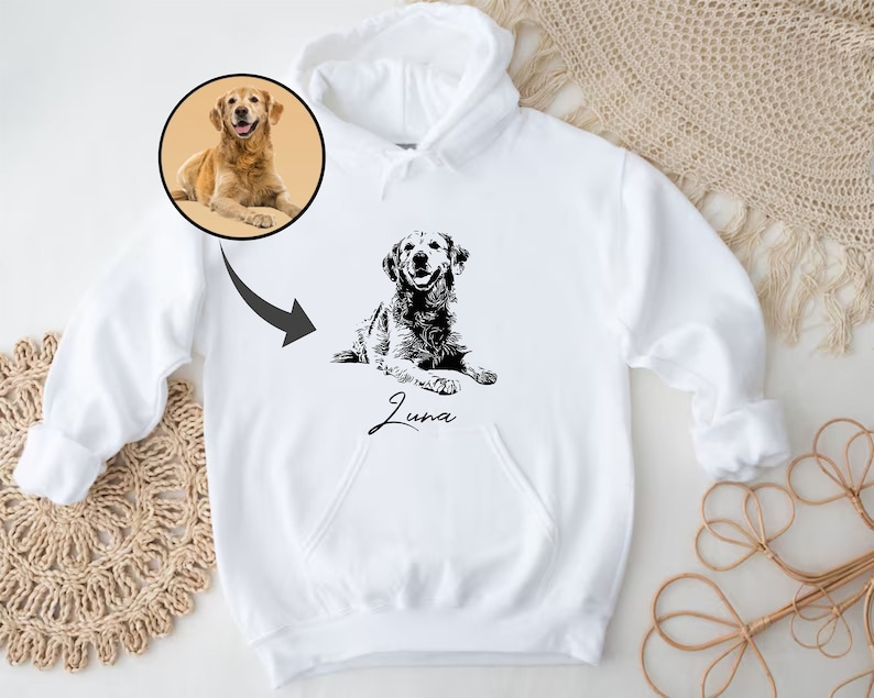 May include: White hoodie with a black and white illustration of a dog with the name "Luna" printed below it.