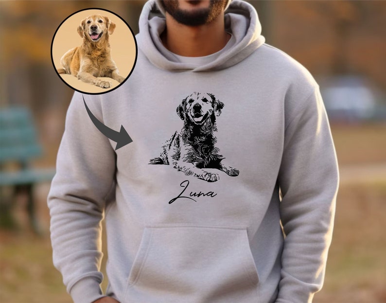 May include: A gray hooded sweatshirt with a black and white illustration of a dog. The dog is lying down and the name "Luna" is written in cursive below the dog.