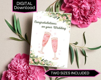 Biglietto di nozze con ciondolo a forma di brindisi sulla parte anteriore con incisione dettagliata e le parole A toast to the happy couple enscribed