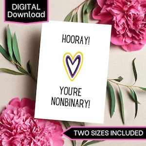 Könnte beinhalten: Eine weiße Grußkarte mit dem Text HOORAY! YOU'RE NONBINARY! und einem zentralen Herzmotiv mit gelben und violetten Umrandungen. Die Karte enthält ein schwarzes Etikett mit der Aufschrift DIGITAL DOWNLOAD und ein weiteres mit TWO SIZES INCLUDED.