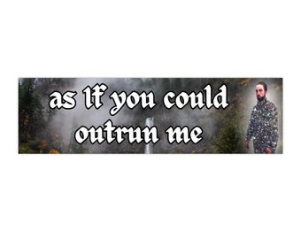 May include: A sticker with a dark background featuring a waterfall and trees. The text "as if you could outrun me" is written in white with a gothic font. A person wearing a sparkly silver jacket is standing on the right side of the sticker.