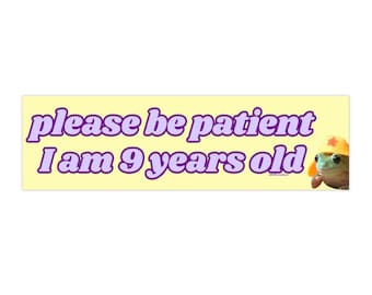 May include: A yellow banner with the text "please be patient I am 9 years old" in purple text. A cartoon frog wearing a red star on a yellow hat is on the right side of the banner.