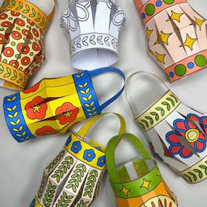May include: A selection of brightly coloured paper lanterns with diverse patterns. The lanterns display floral, star, and geometric designs in orange, yellow, blue, and green. Each lantern has a handle, and some are left blank for colouring.