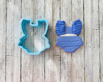 Kakutform till onesie med volang, onesie-utformare, babyutformare, babyshower-utformare, klädutformare, babyklänningsutformare, flickutformare