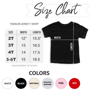 May include: A black toddler jersey t-shirt with a size chart. The chart shows sizes 2T to 5-6T, with width measurements from 30.5cm to 38.1cm and lengths from 39.4cm to 47cm. Color options include white, black, natural, athletic heather, pink, and red.