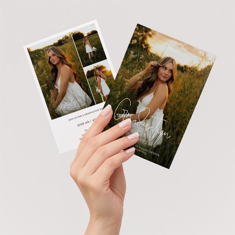 May include: Two graduation announcement cards featuring a young woman in a white dress in a field of tall grass. The cards have the text "Graduation" and "June 4th" in a handwritten font. The cards are held by a person.