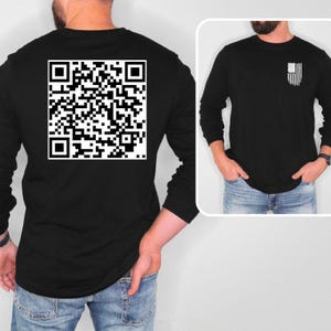 May include: Black long-sleeve shirt with a white QR code on the back and a small American flag on the right side of the chest.