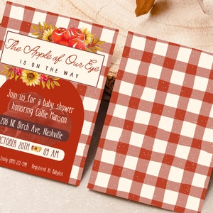 May include: Baby shower invitation with a red and cream gingham pattern. The invitation includes the text "The Apple of Our Eye Is On The Way" and details for a baby shower honouring Callie Hanson.