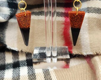 Epoxy poured orange and black triangle hypoallergenic stud earrings