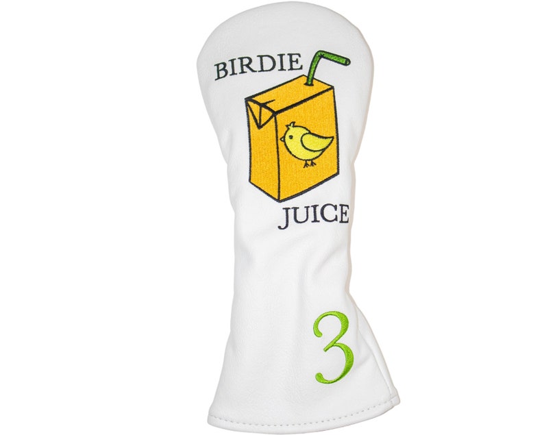 May include: White golf headcover with a yellow juice box design. The juice box has a yellow bird and the text "Birdie Juice". The number "3" is embroidered on the bottom of the headcover.